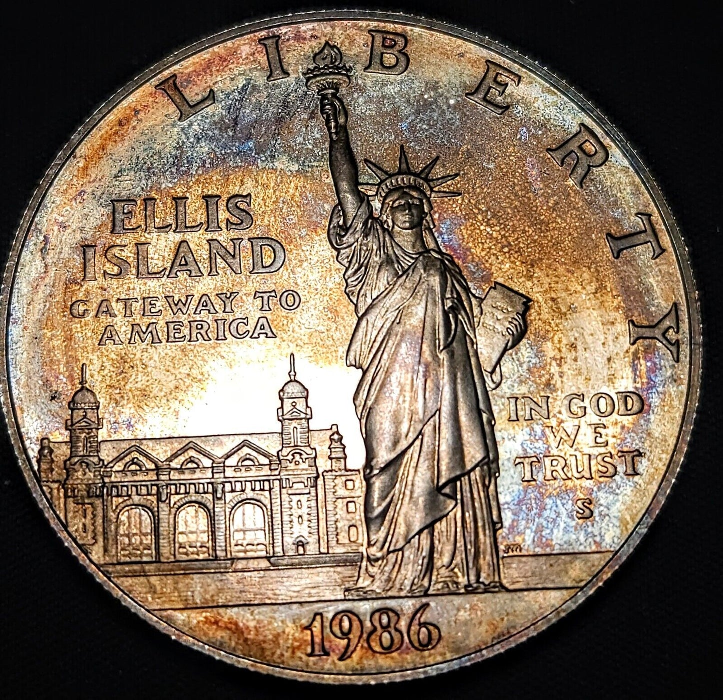 1986 S Proof Ellis Island Dollar Bu Rainbow Toned