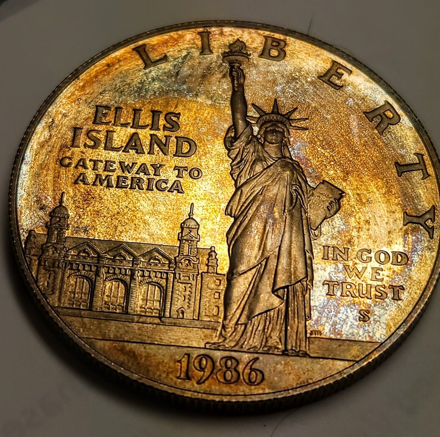 1986 S Proof Ellis Island Dollar Bu Rainbow Toned